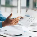 Person working through investment options.